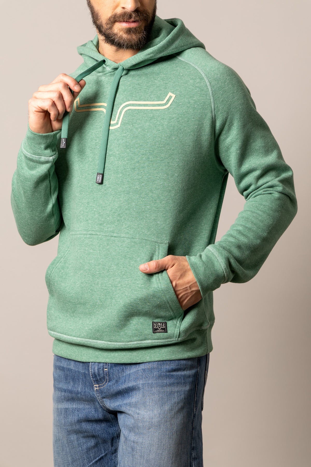 Kimes Ranch Outlier Hoodie in Green Heather with a front kangaroo pocket and a graphic print on the chest