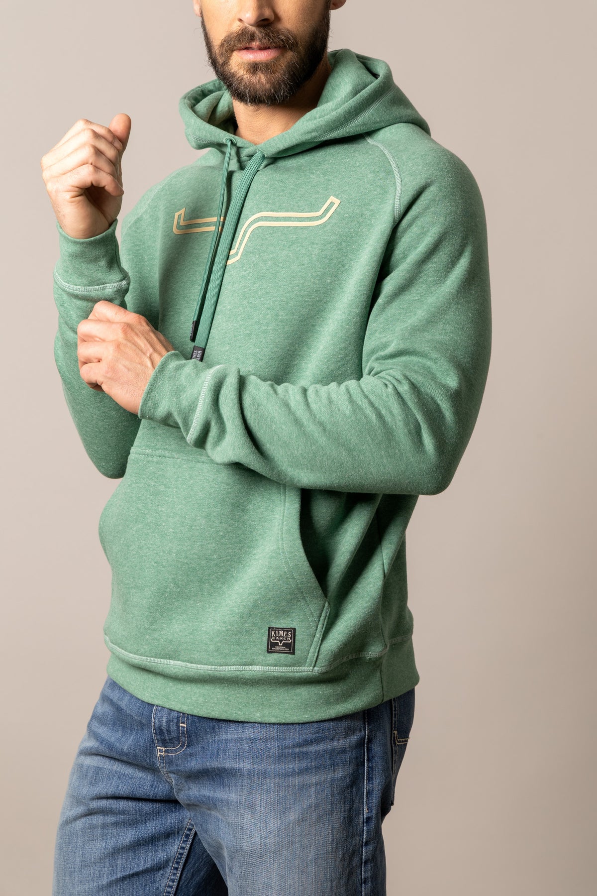 Kimes Ranch Outlier Hoodie in Green Heather with a front kangaroo pocket and a logo patch