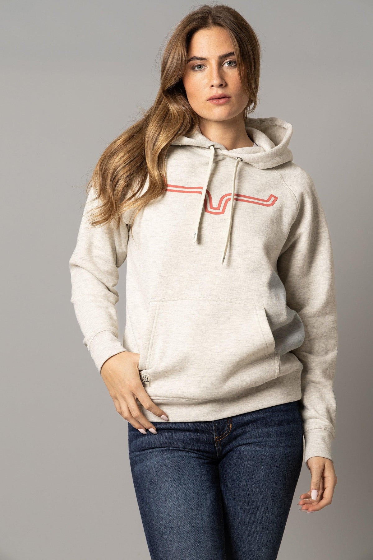 Kimes Ranch Ladies Outlier Hoodie in Oatmeal Heather with a red logo and kangaroo pocket