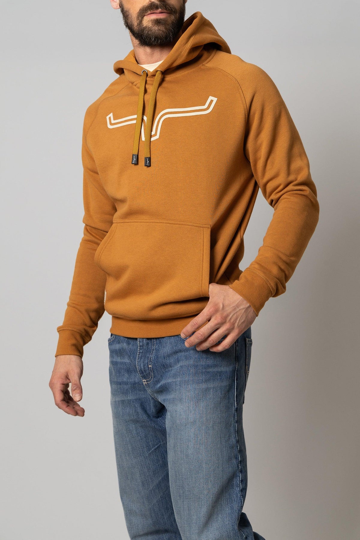 Kimes Ranch Outlier Hoodie in Work Wear Brown with a white graphic logo on the chest and a front kangaroo pocket