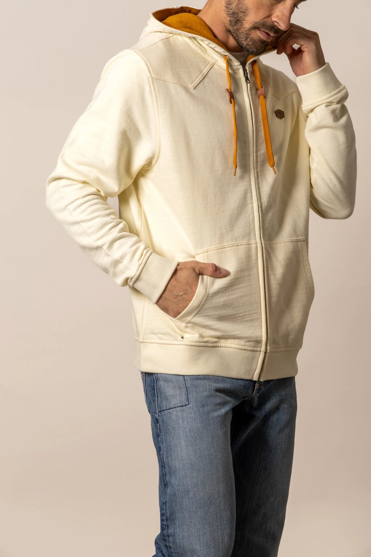 Kimes Ranch Overo Full Zip hoodie in Natural, side view, with mustard drawstrings and front pockets