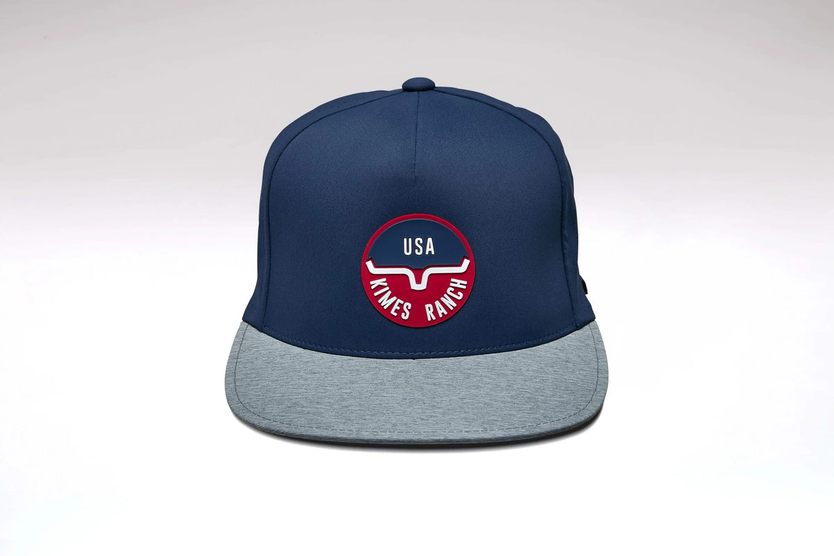 Kimes Ranch Palma hat in Blue with a grey brim and the Kimes Ranch logo on the front