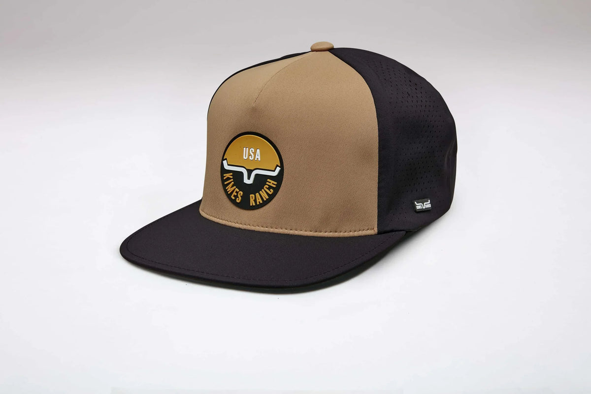 Kimes Ranch Palma hat in Work Wear Brown, side view, with a flat brim and a circular USA logo patch on the front