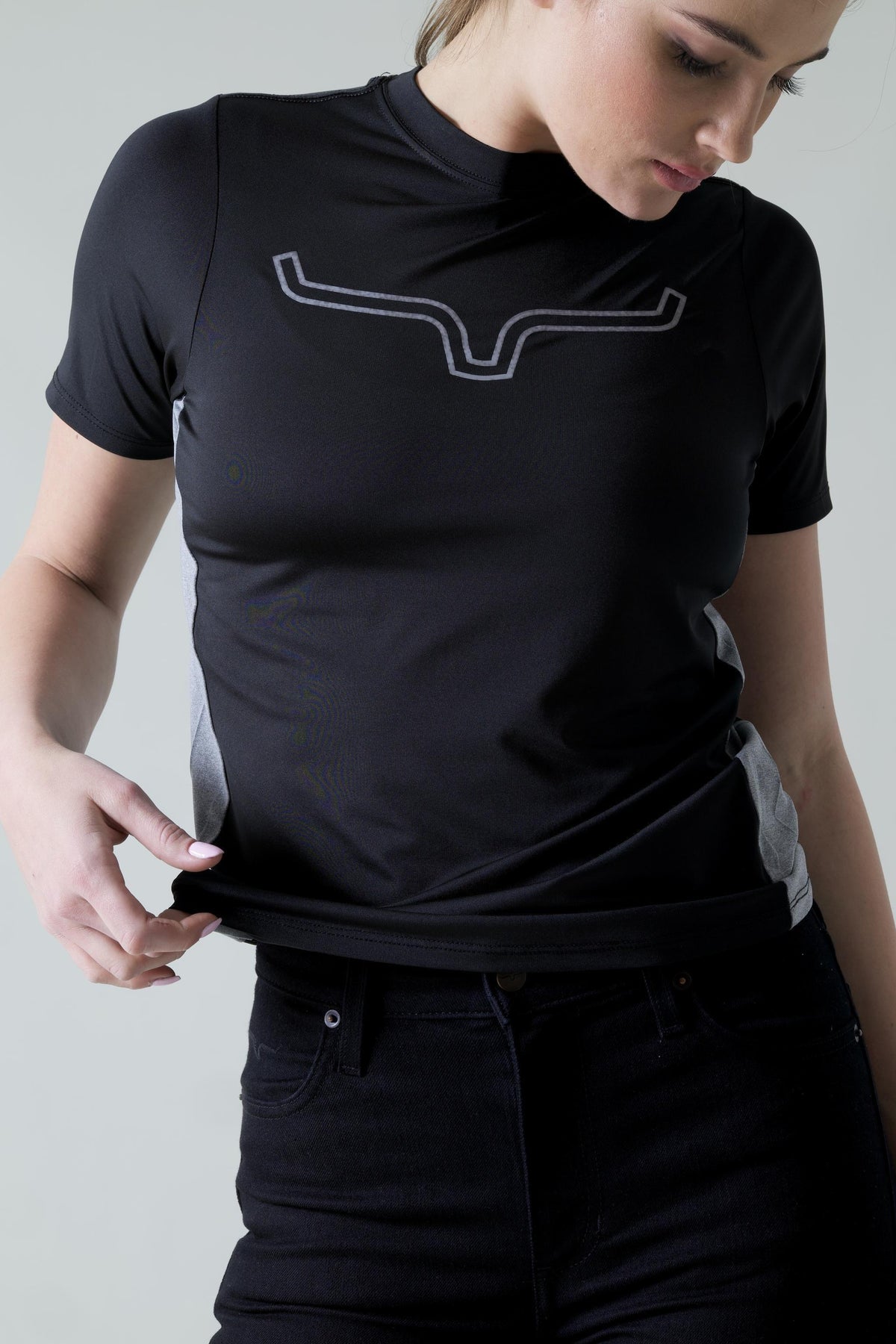 Kimes Ranch Ladies Phase 2 Tech Shirt in Black with a grey logo and grey side panels