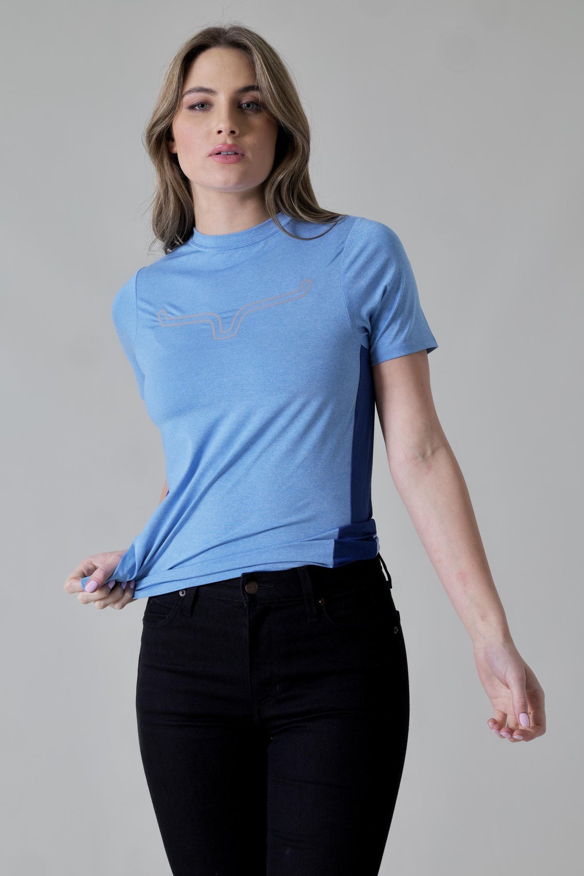 Kimes Ranch Ladies Phase 2 Tech Shirt in Turq Heather with a tonal logo on the chest and contrast side panels