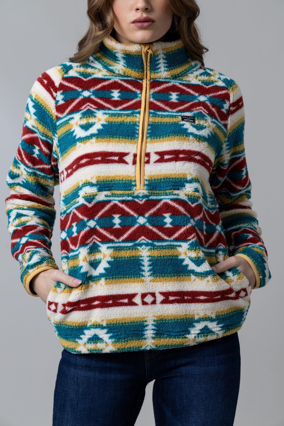 Kimes Ranch Roswell Polar Fleece sweatshirt in Matcha with a multi-color geometric pattern and a front zip pocket