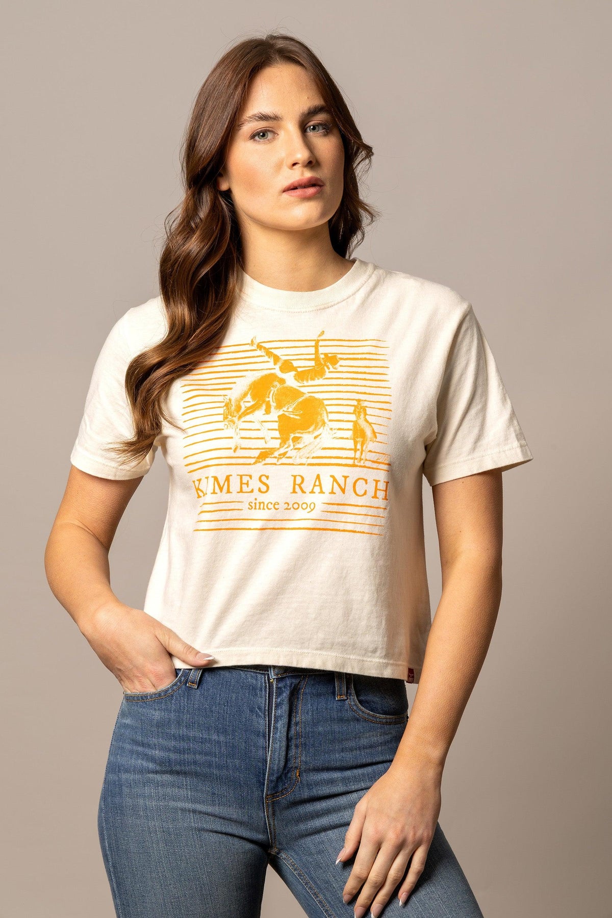 Kimes Ranch Randy Bareback shirt in Ivory with a graphic of a cowboy on a bucking horse and the text KIMES RANCH since 2009