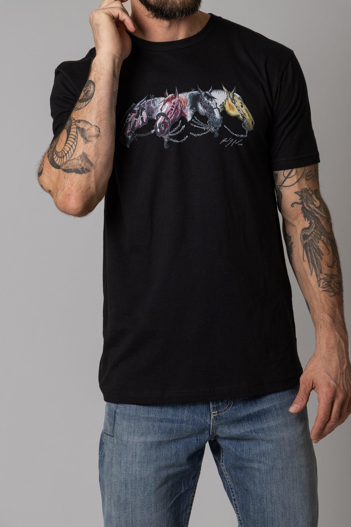 Kimes Ranch Randy Paul NRCHA Derby Tee Shirt in Black with a graphic of three horses in a race