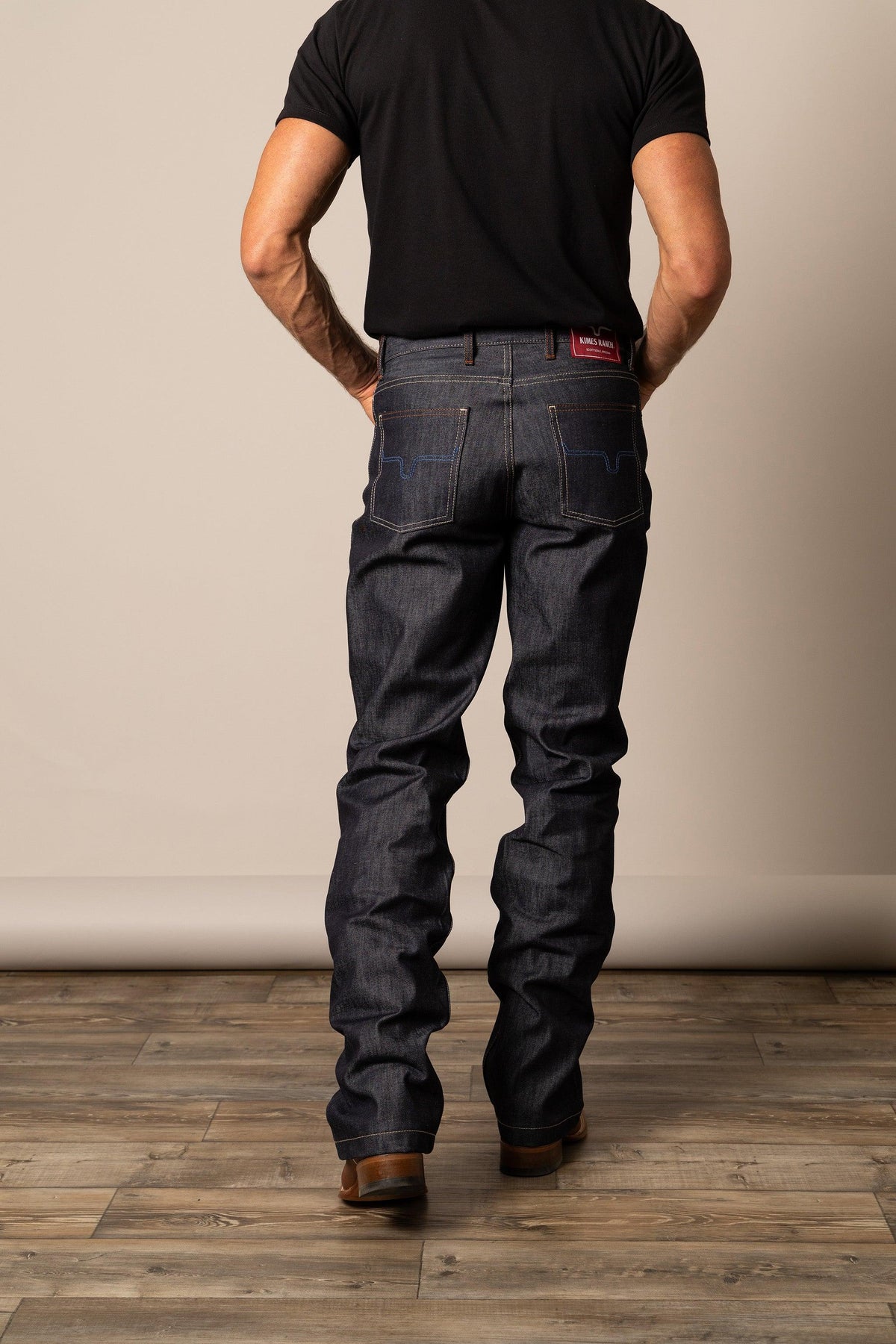 Kimes Ranch Raw Dillon Relaxed Bootcut jeans in Dark Wash, back view, with contrast stitching and back pockets