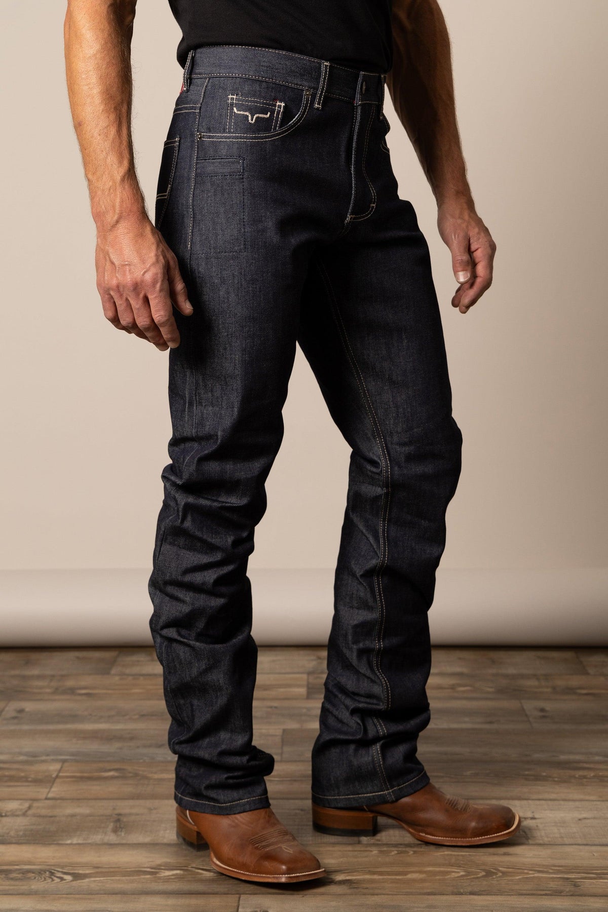 Kimes Ranch Raw James Straight Fit Bootcut jeans in dark indigo with contrast stitching and a back pocket logo