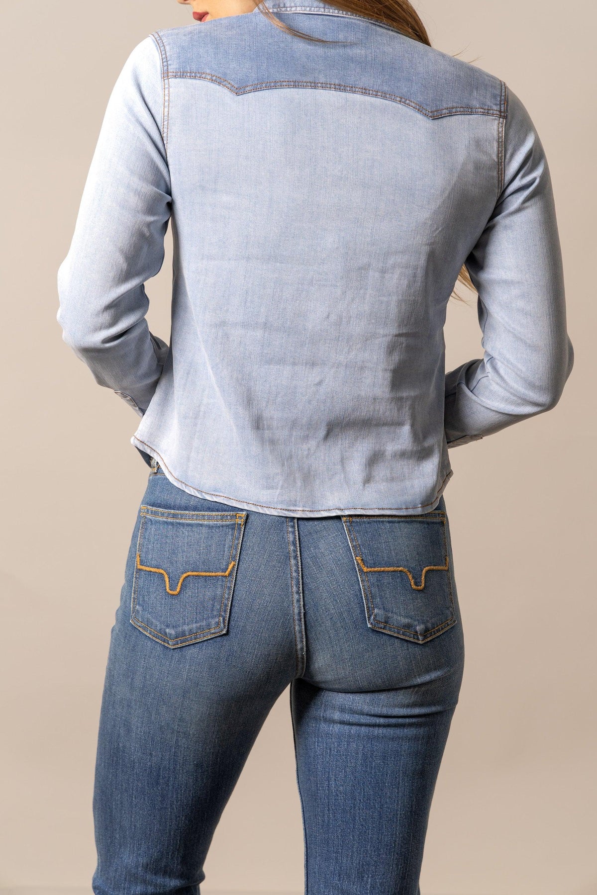 Kimes Ranch Rayna top in Light Wash Indigo, back view, with long sleeves and a back yoke