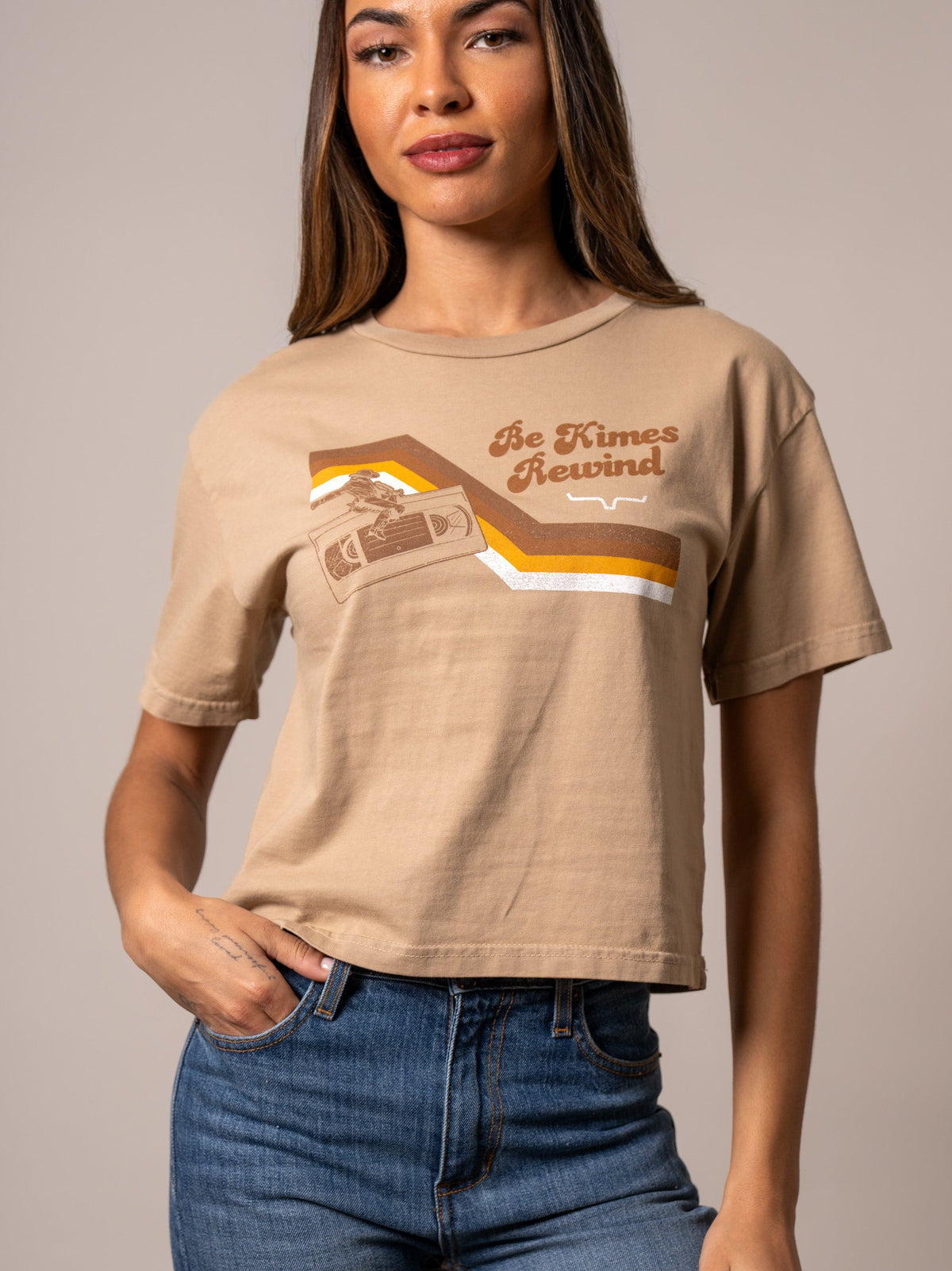 Kimes Ranch Rewind shirt in Tan with a graphic of a cassette tape and the text Be Kimes Rewind