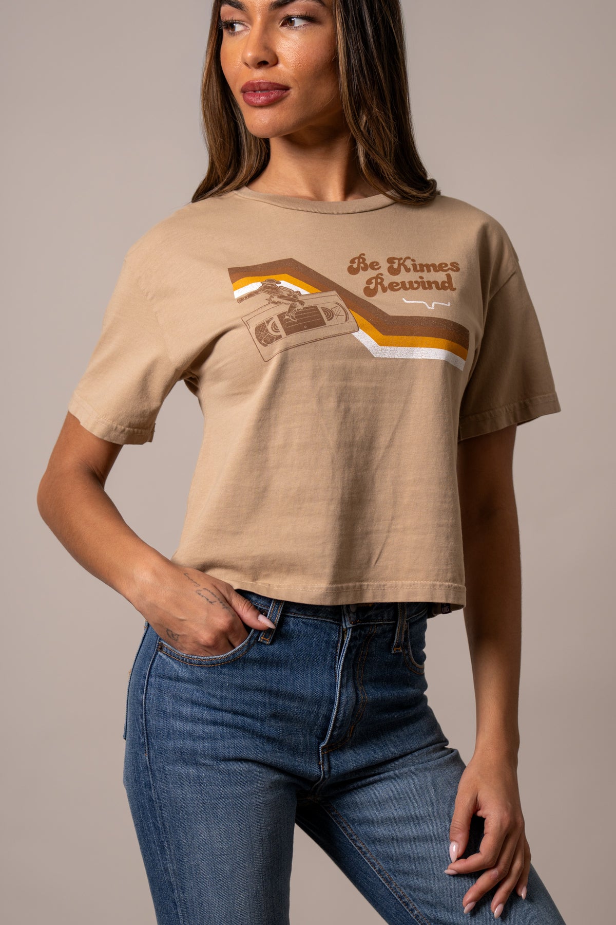 Kimes Ranch Rewind shirt in Tan with a graphic of a cassette tape and the text Be Kimes Rewind