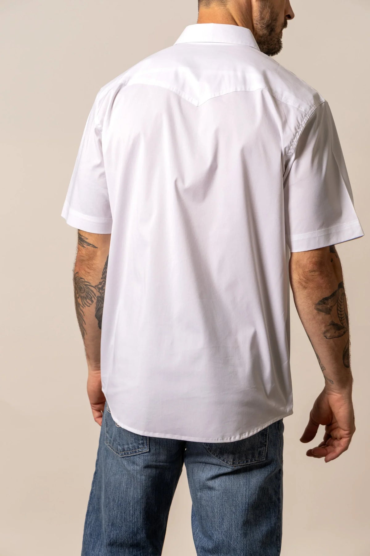 Kimes Ranch Rio Short Sleeve Dress Shirt in White, back view, with a back yoke and short sleeves