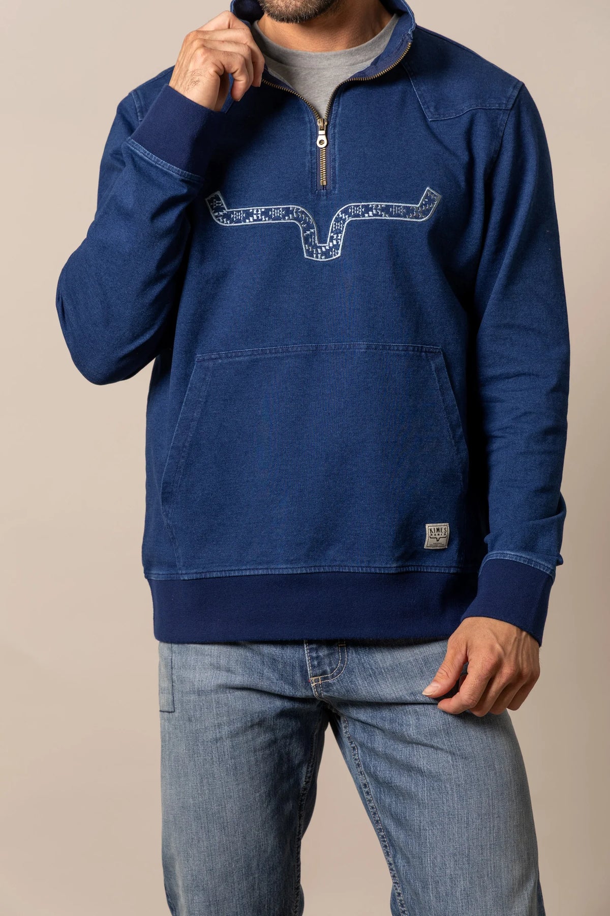 Kimes Ranch Rowell Pullover sweatshirt in Indigo with a front kangaroo pocket and a graphic print on the chest