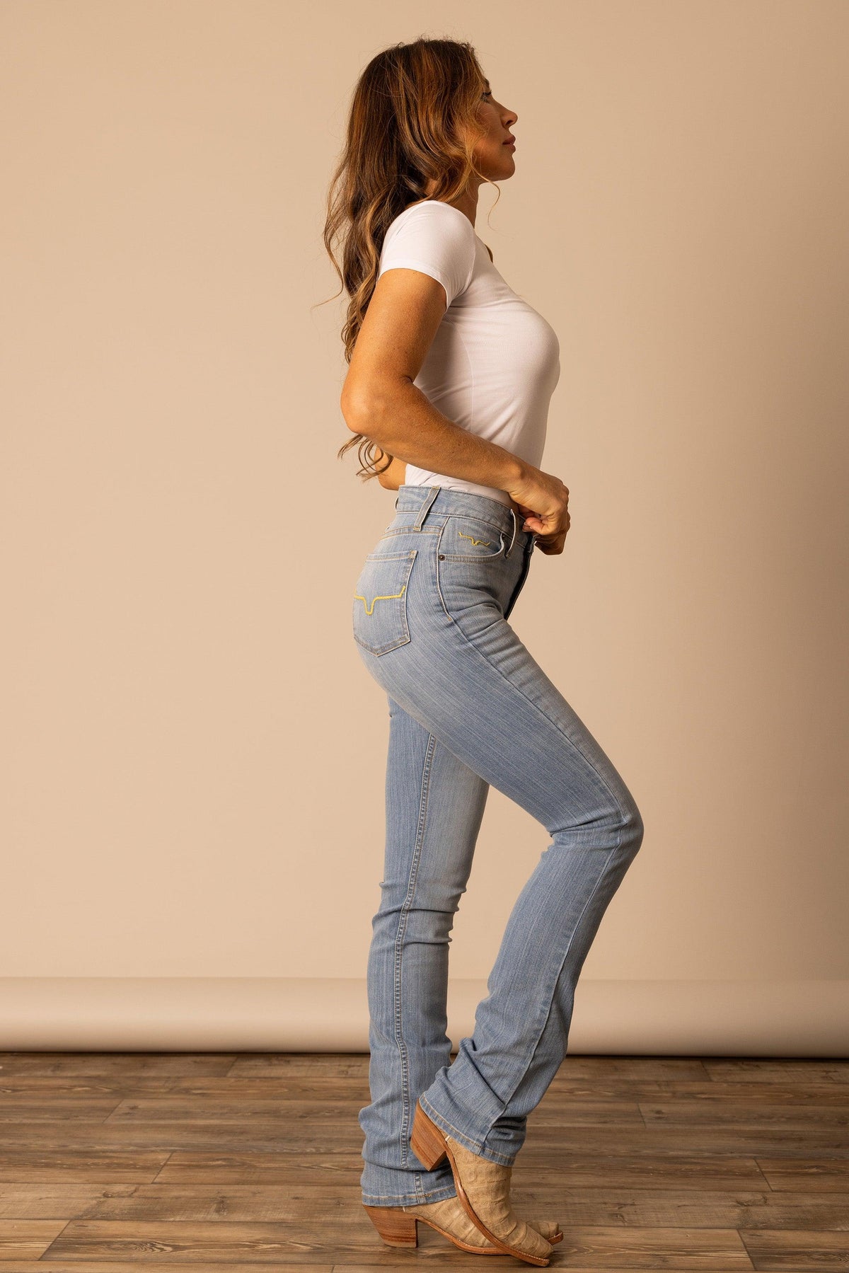 Kimes Ranch Sarah jeans in Light Wash, side view, with signature yellow stitching on the back pockets
