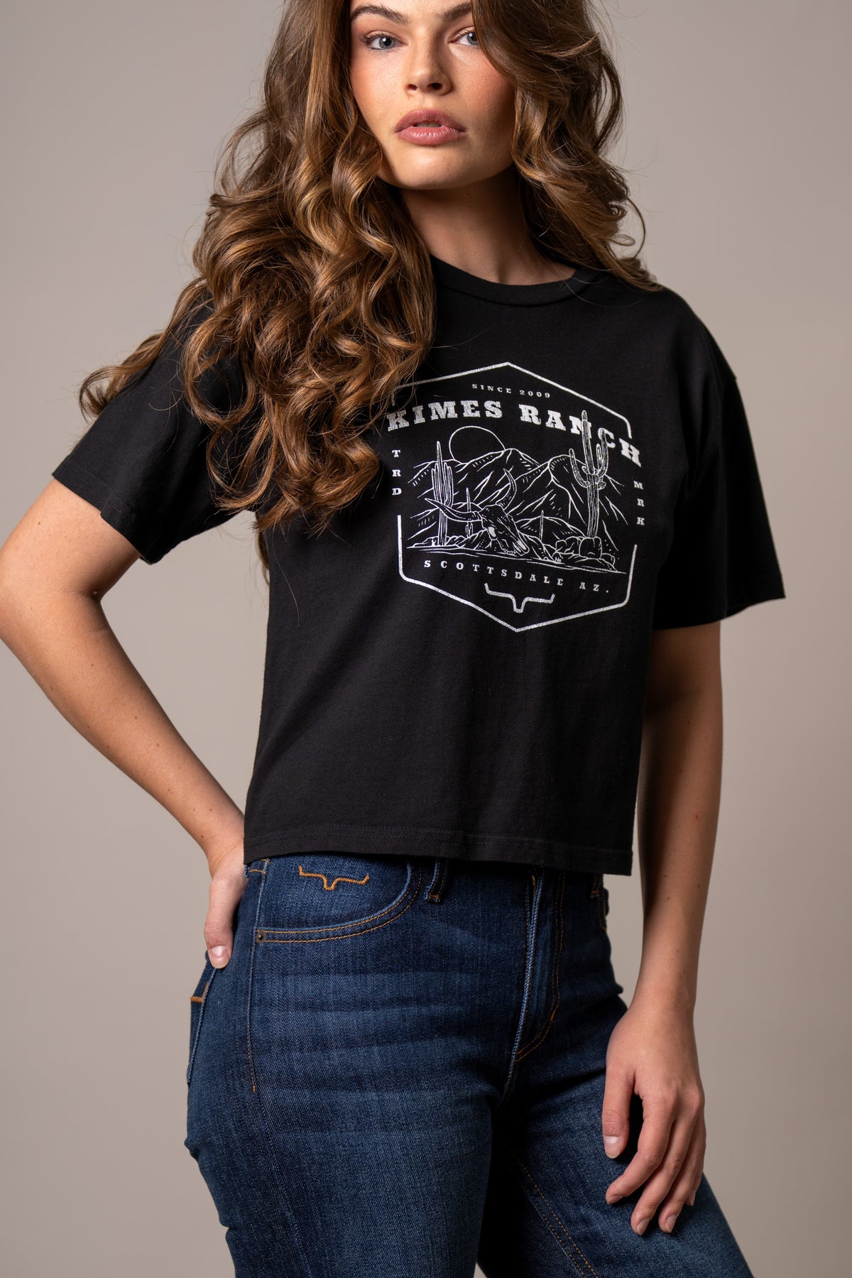 Kimes Ranch See For Miles Black shirt with a white graphic of a desert scene and cacti