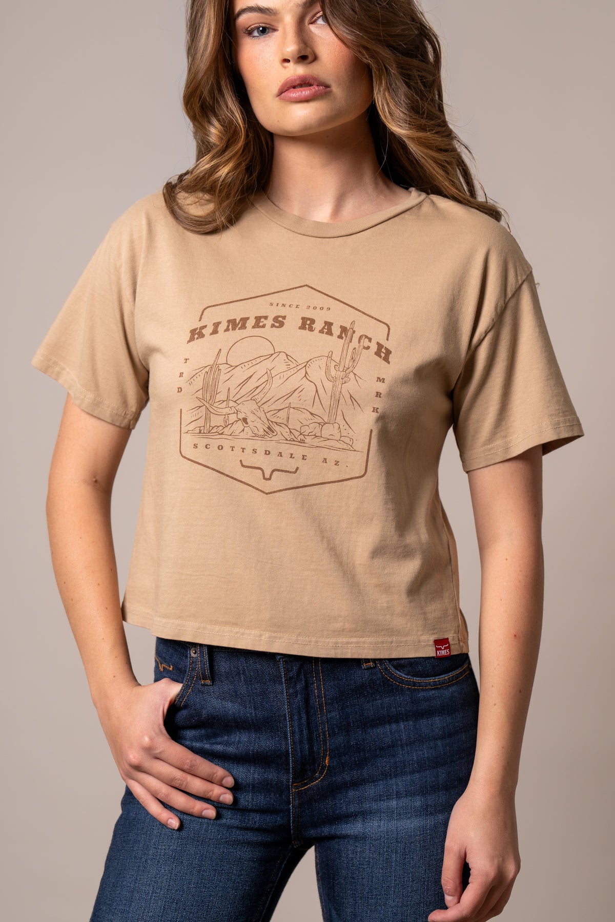 Kimes Ranch See For Miles shirt in Tan with a graphic of a desert landscape and the Kimes Ranch logo