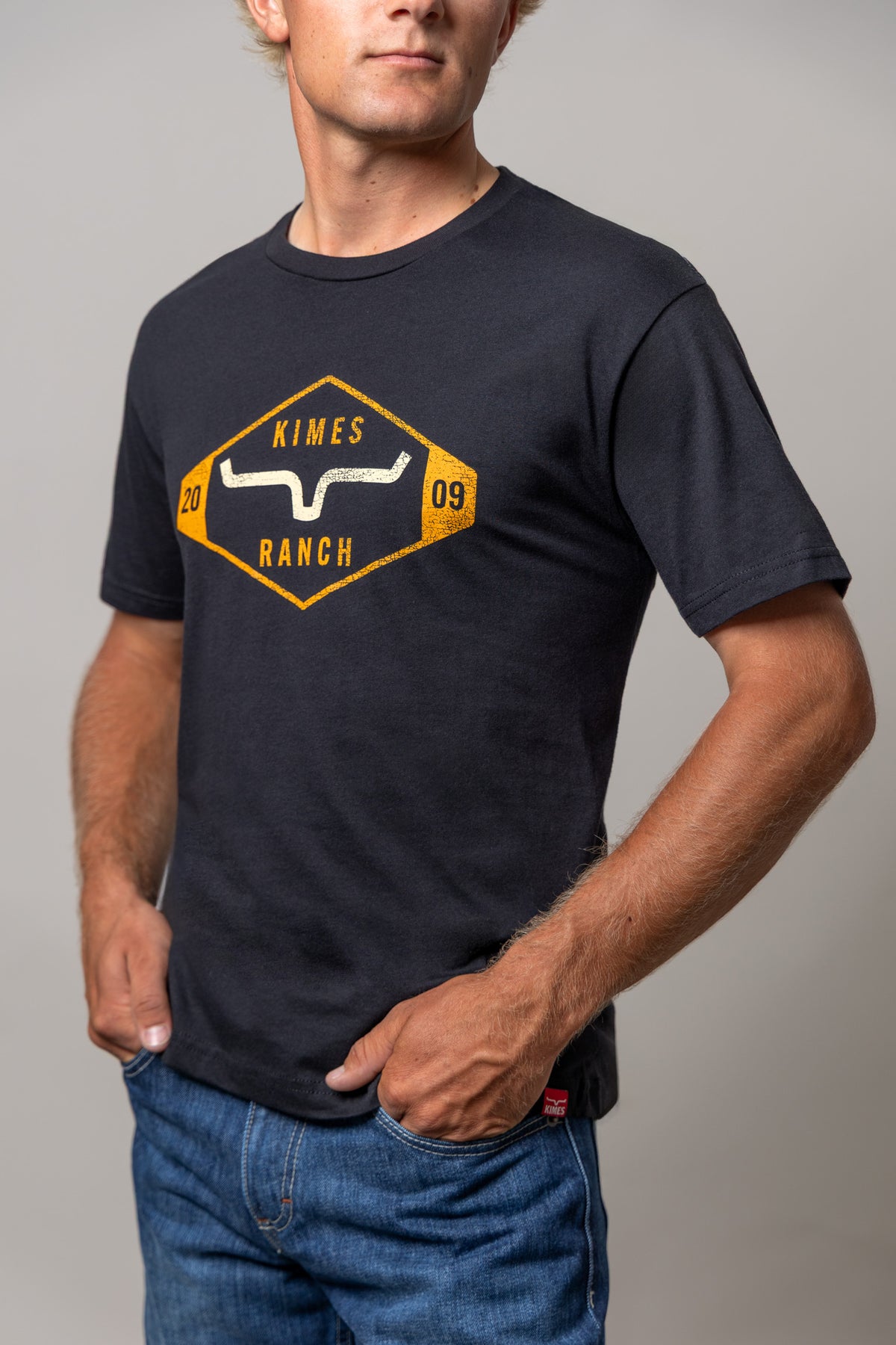 Kimes Ranch Serrano shirt in Black with a vintage diamond logo graphic featuring the brand name and a steer mark
