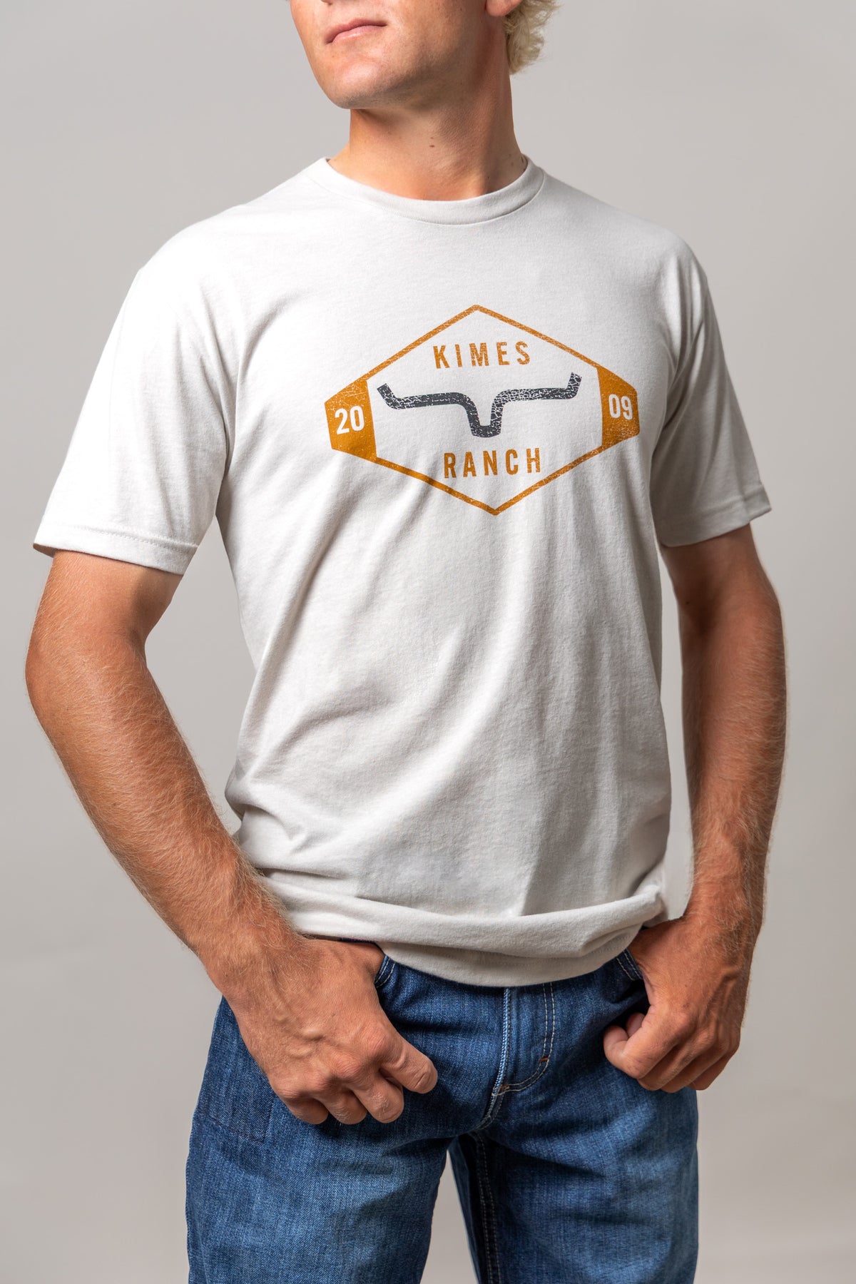 Kimes Ranch Serrano shirt in Sand with a vintage diamond logo graphic featuring the brand name and steer mark
