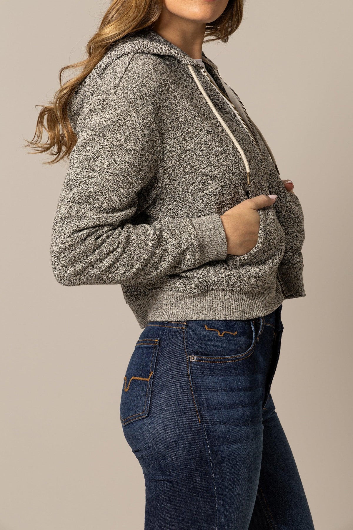 Kimes Ranch Shelly Hoodie in Natural, side view, with a marled texture, long sleeves, and front pockets