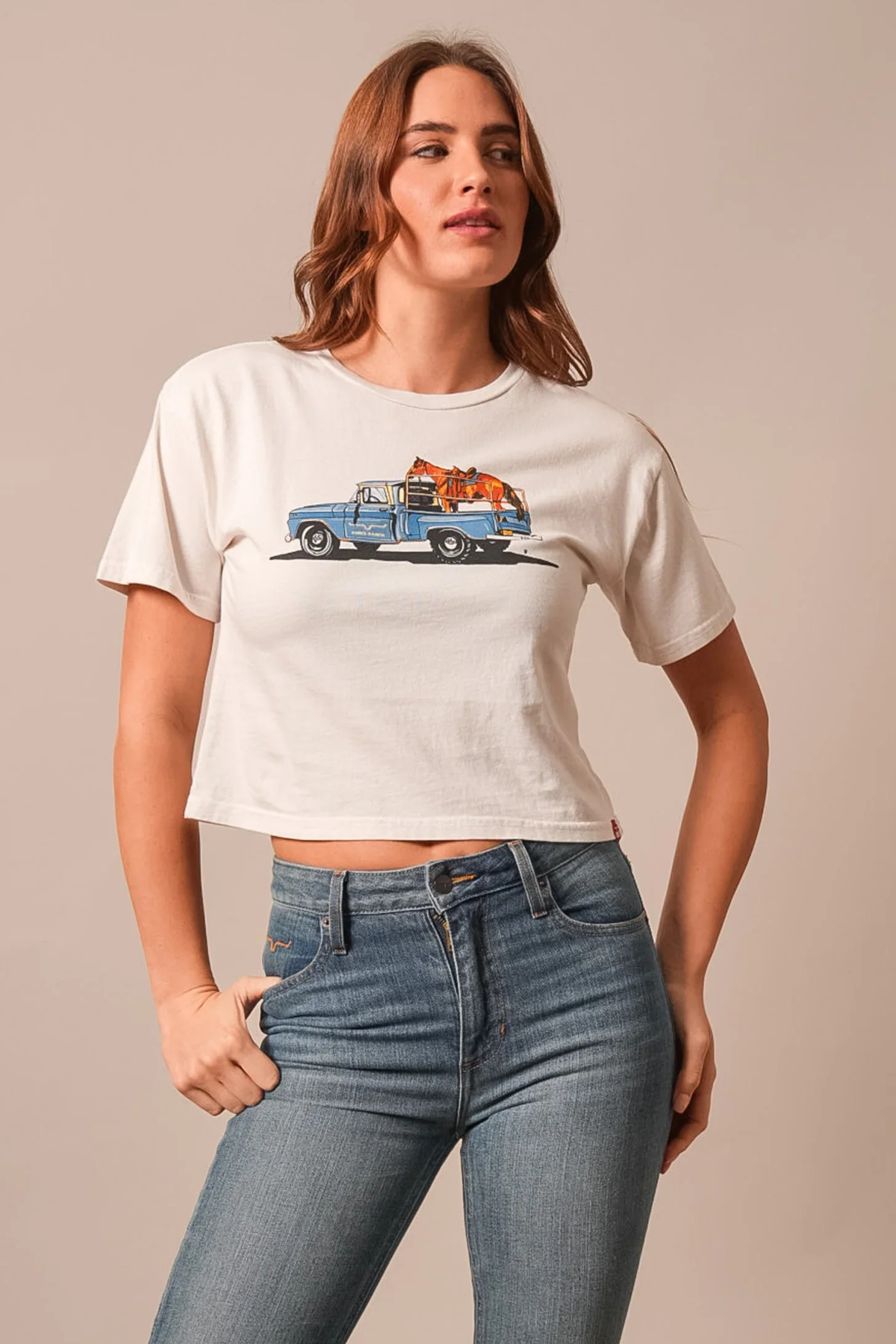 Kimes Ranch Lucky B Pick Up shirt in Bone with a graphic of a blue pickup truck carrying a steer