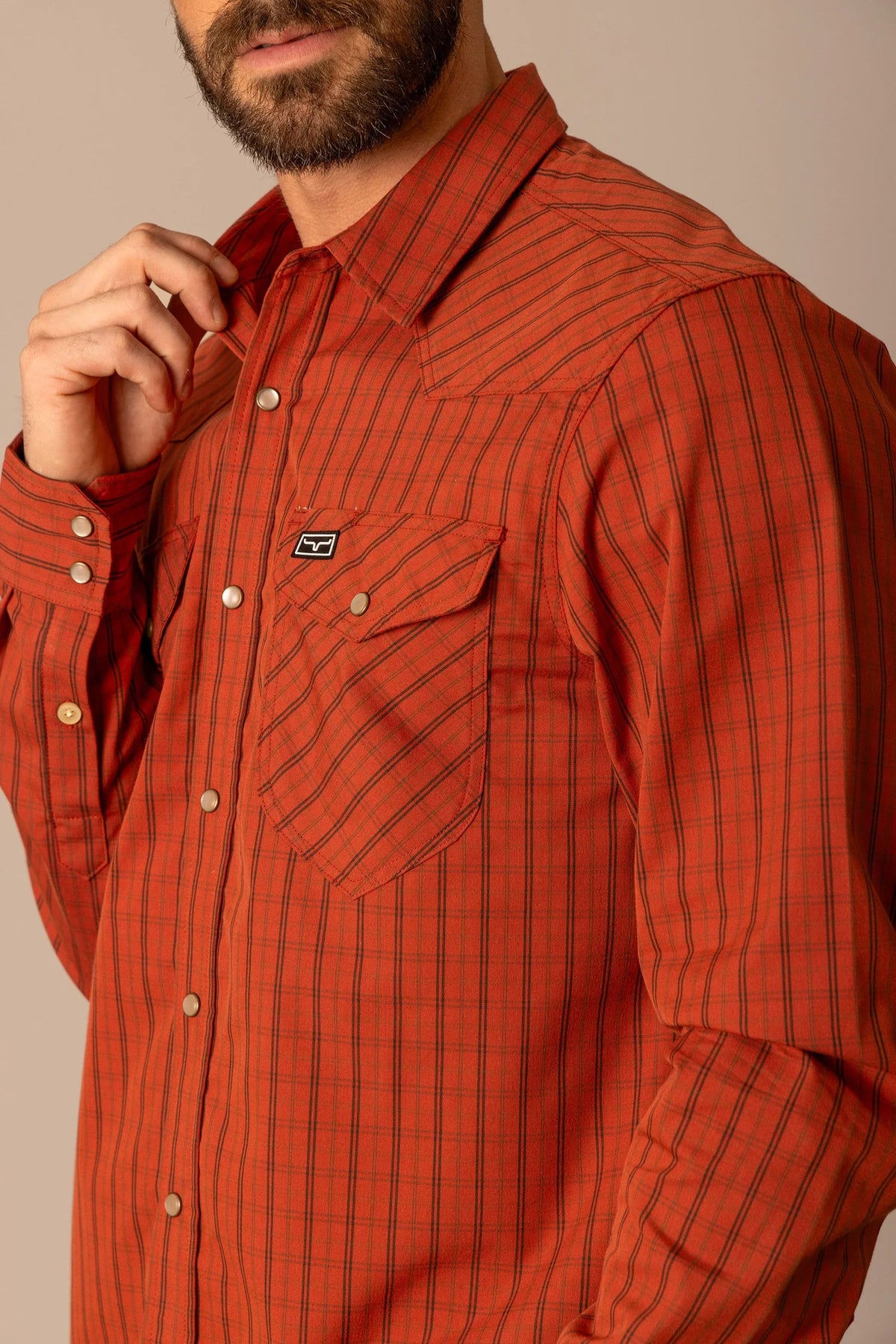Kimes Ranch Smalls dress shirt in Brick Red with a plaid pattern and chest pocket featuring the Kimes Ranch logo