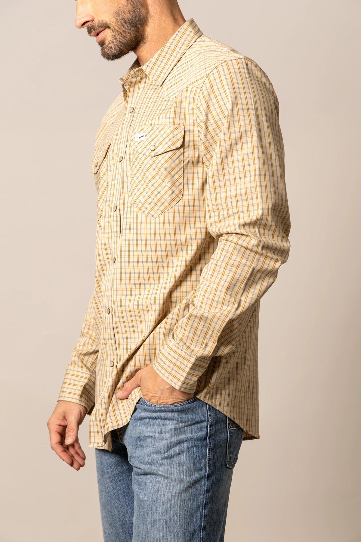 Kimes Ranch Smalls dress shirt in Tan, side view, with a plaid pattern and chest pockets
