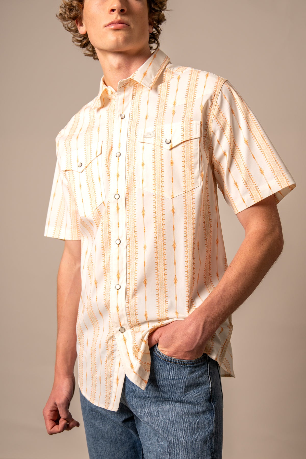 Kimes Ranch Sonny short sleeve dress shirt in Orange with a vertical pattern and two chest pockets