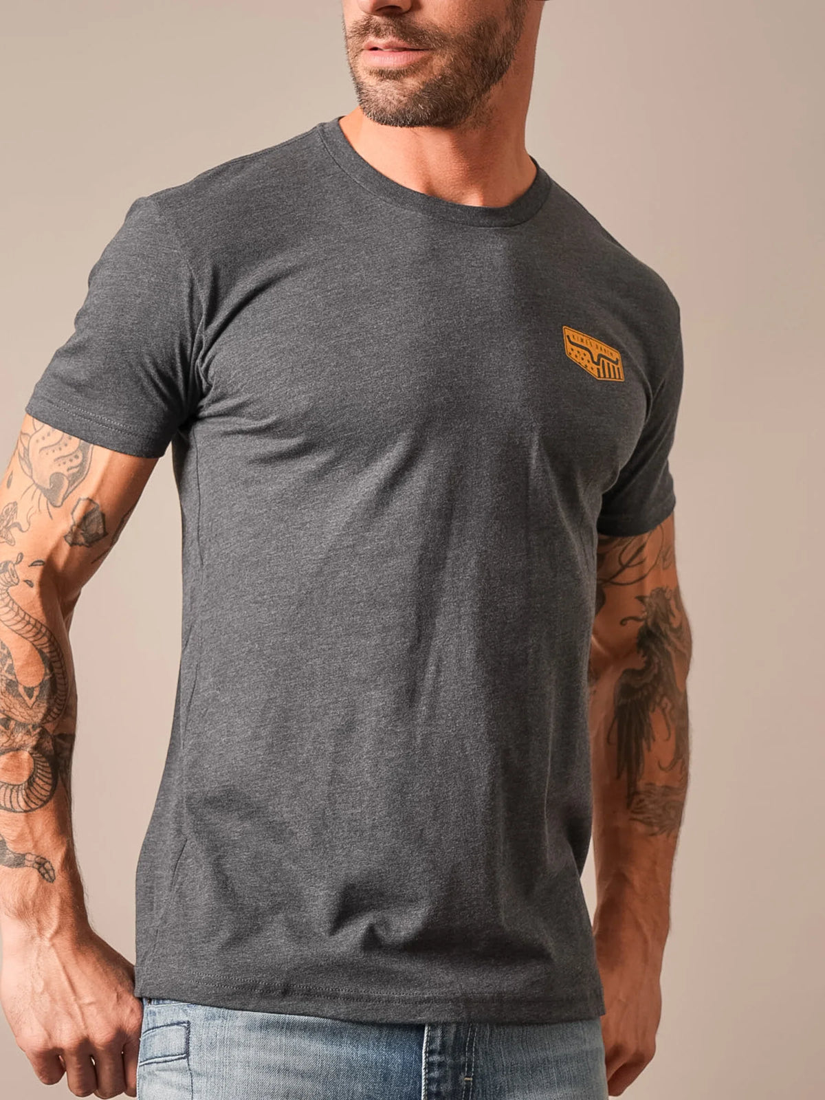 Kimes Ranch Spangled Charcoal short sleeve shirt with a crew neck and a small Kimes Ranch logo on the chest