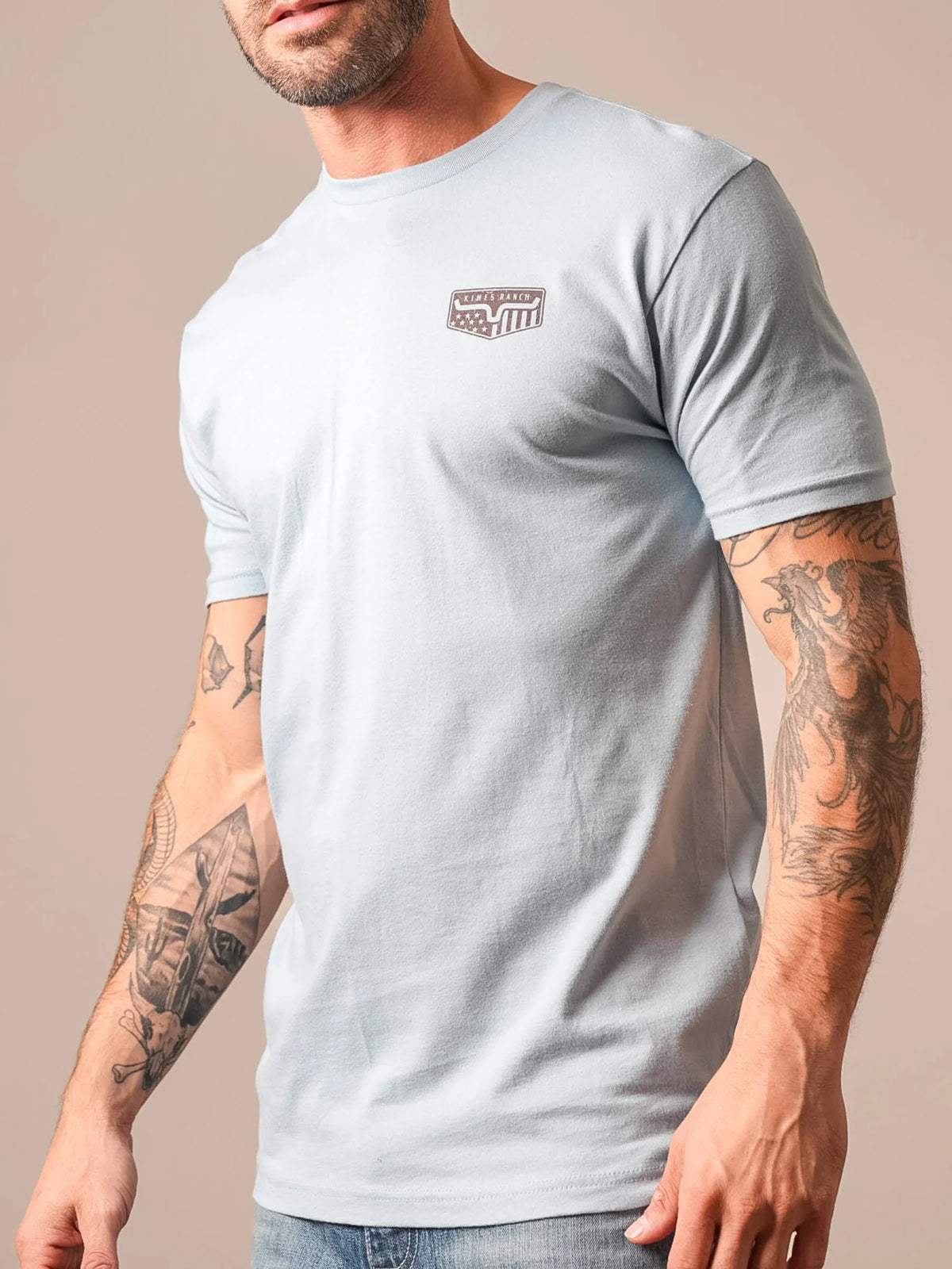 Kimes Ranch Spangled, side view, shirt in Stonewash with a crew neck and short sleeves and a chest logo