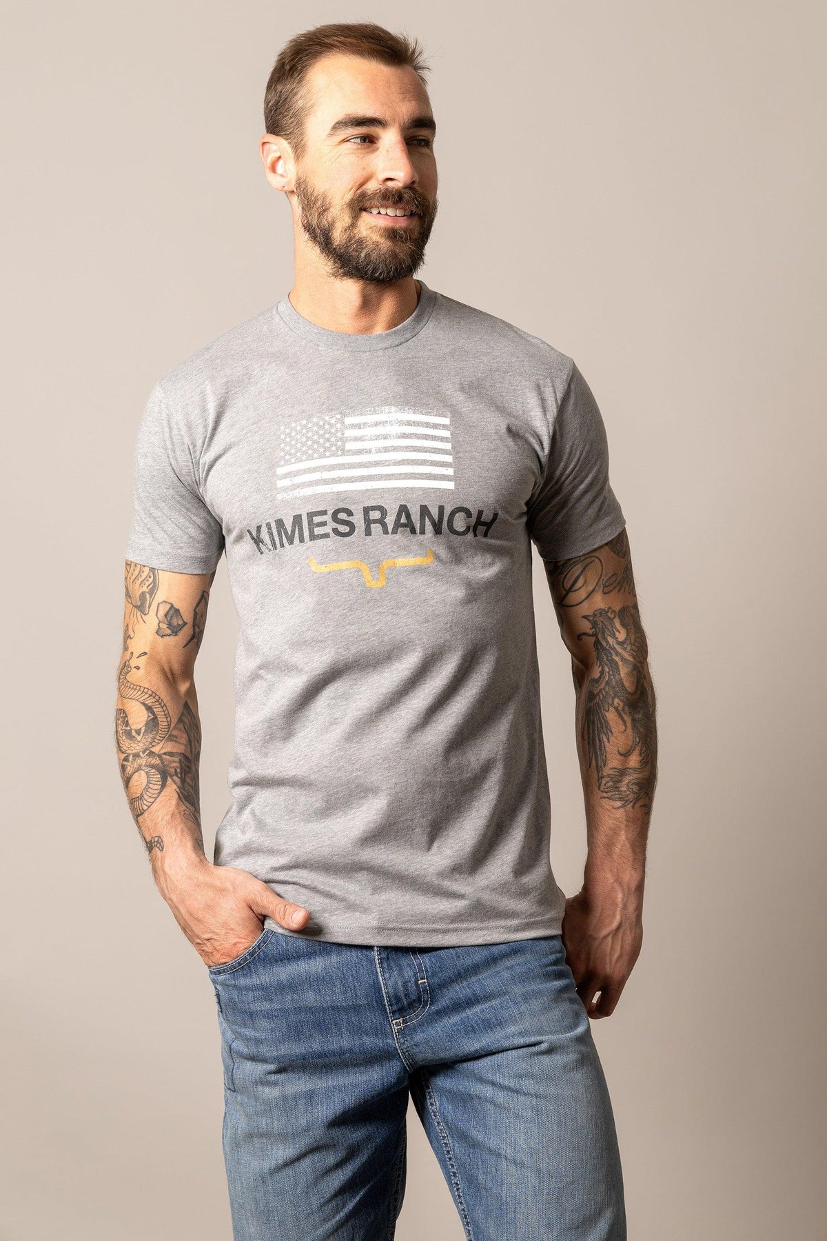 Kimes Ranch Stability shirt in Dark Grey Heather with a flag graphic and the Kimes Ranch logo