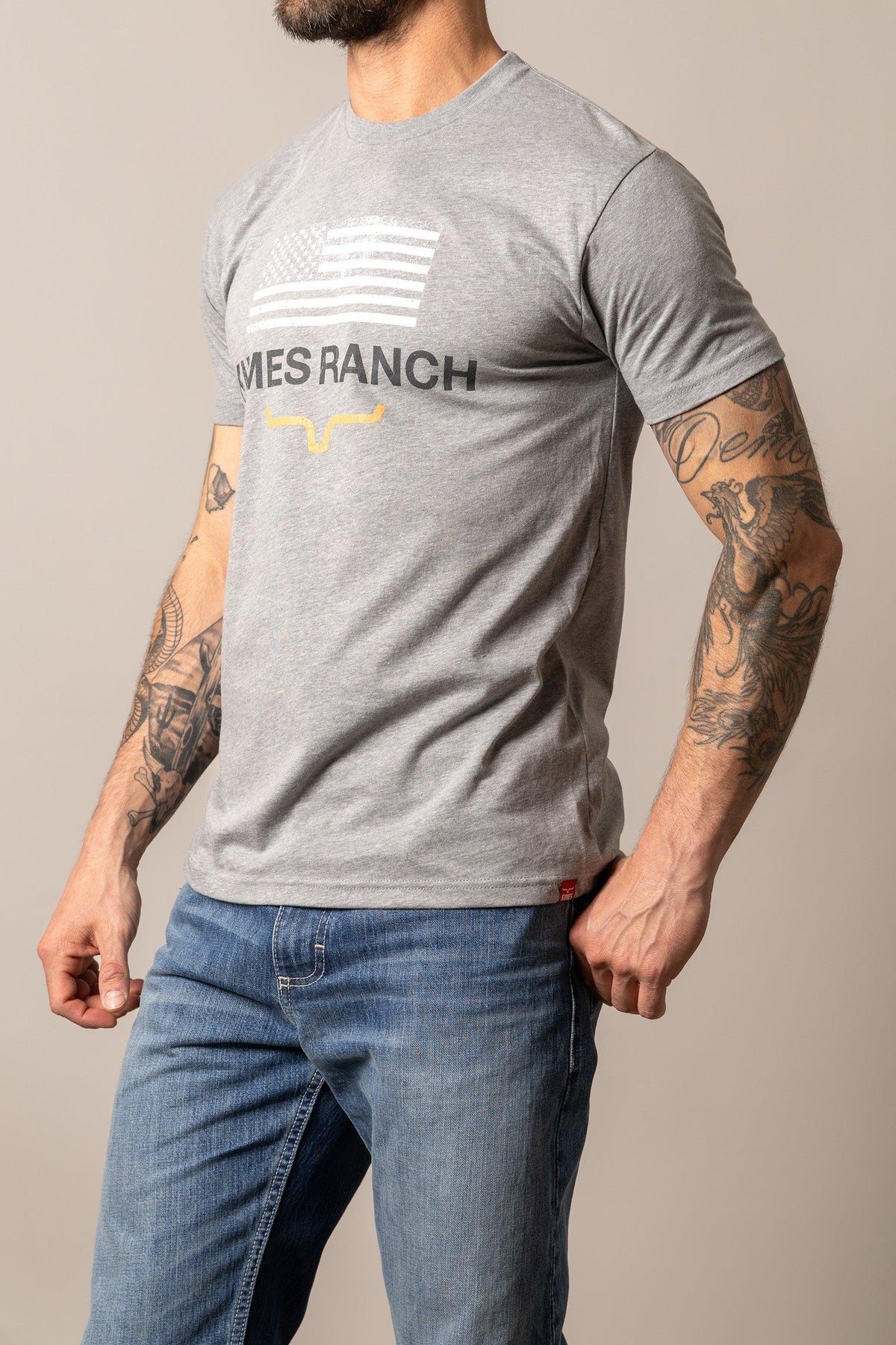 Kimes Ranch Stability shirt in Dark Heather Grey with a white flag graphic and Kimes Ranch logo