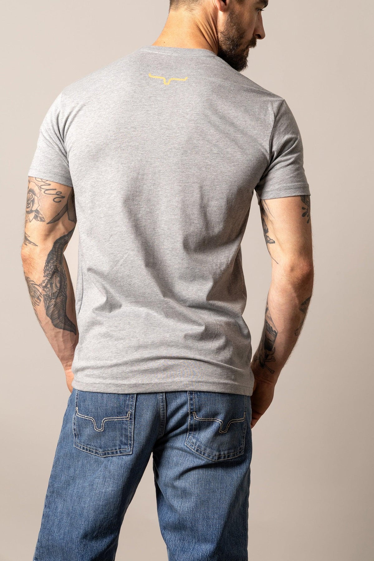 Kimes Ranch Stability shirt in Dark Heather Grey, back view, with the Kimes Ranch logo at the back yoke