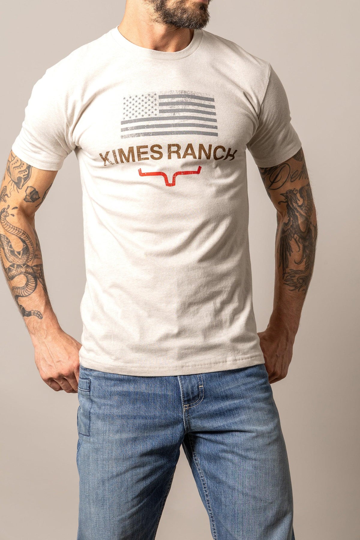 Kimes Ranch Stability shirt in Sand with a distressed American flag graphic and the Kimes Ranch logo