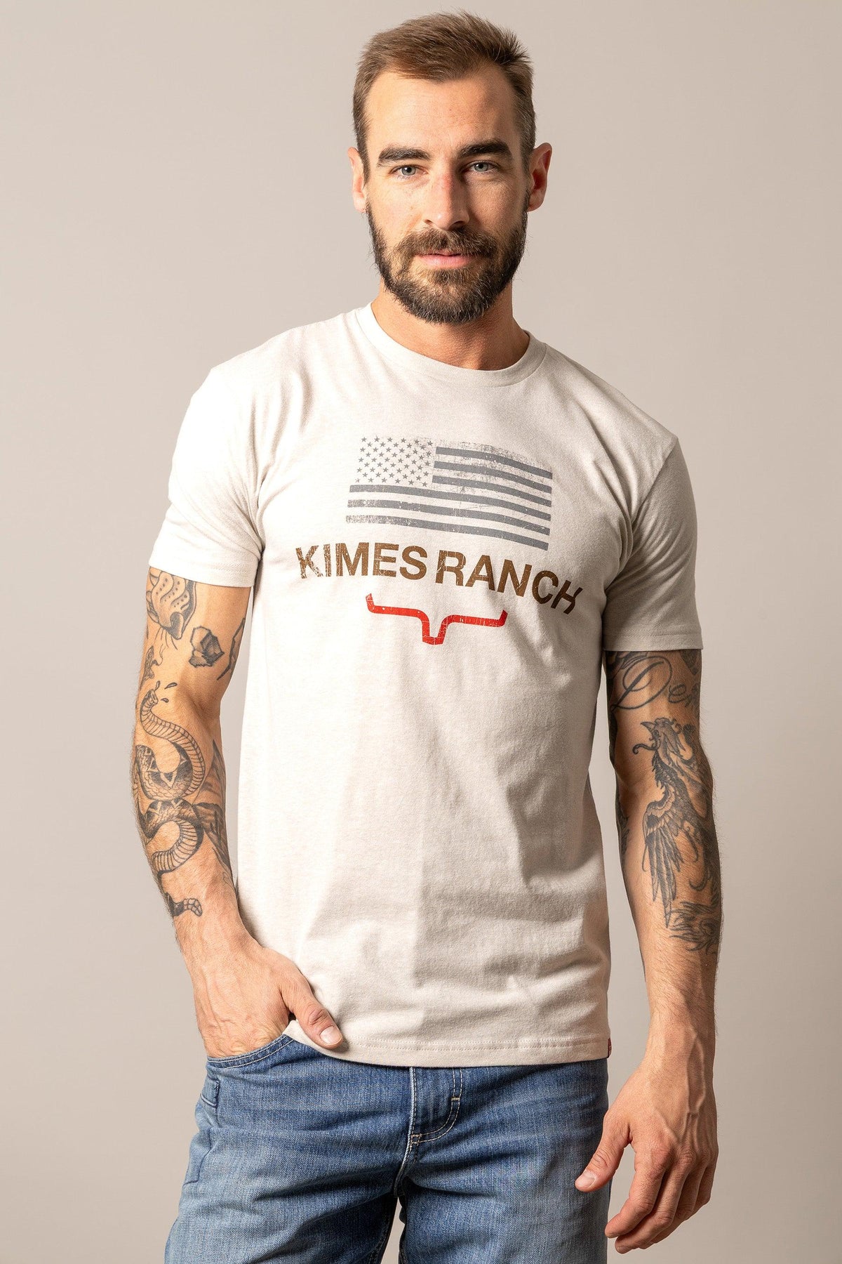 Kimes Ranch Stability shirt in Sand with a distressed American flag graphic and the Kimes Ranch logo