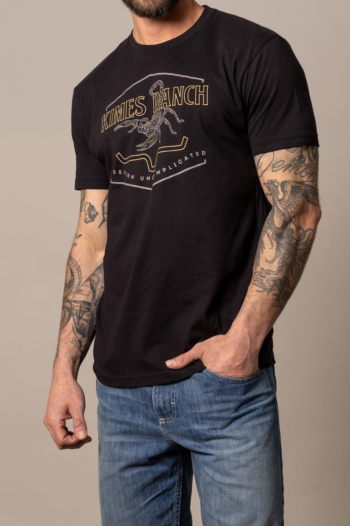 Kimes Ranch Sting shirt in Black with a graphic print featuring a scorpion and the text Western Uncomplicated