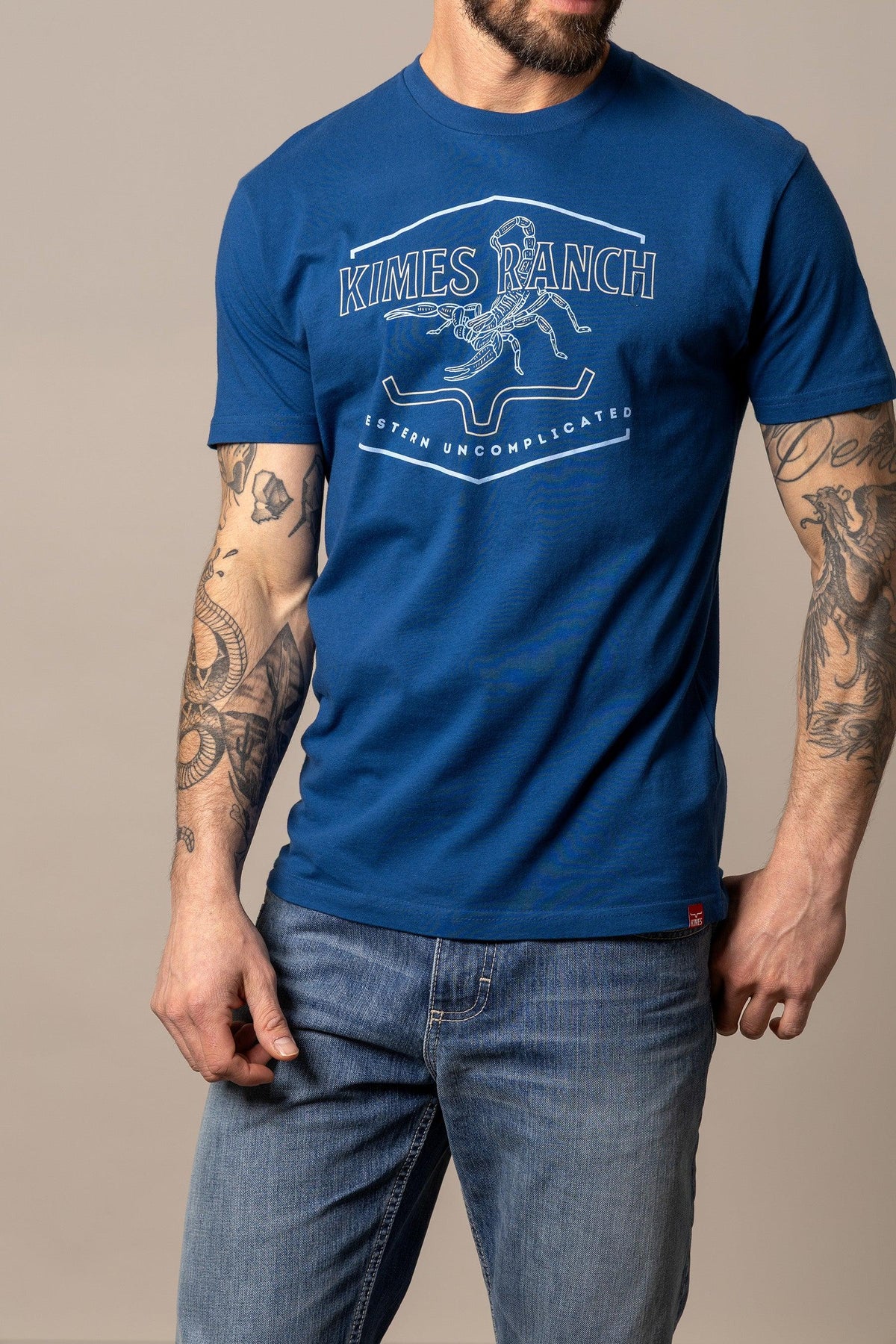 Kimes Ranch Sting shirt in Marine Blue with a white graphic of a scorpion and the text Kimes Ranch Western Uncomplicated