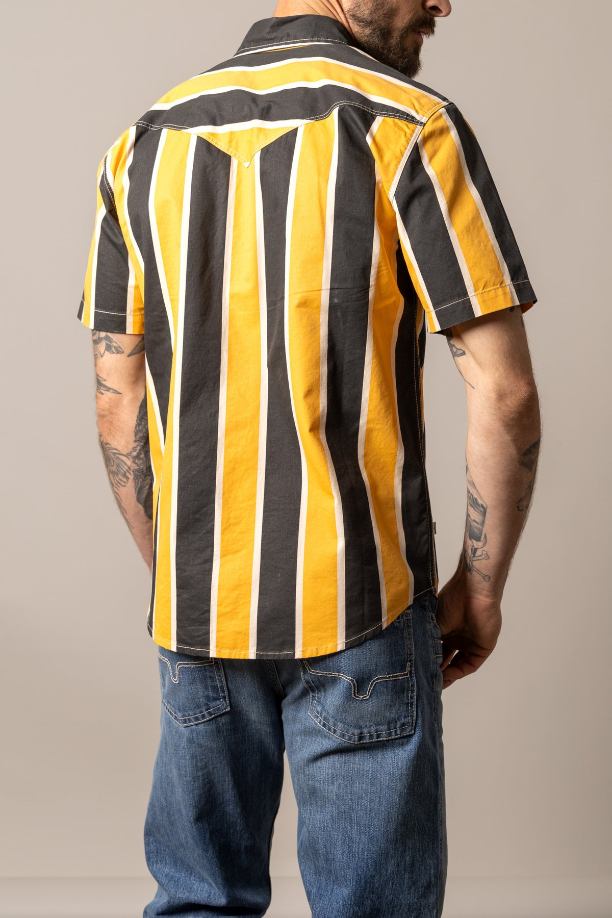 Kimes Ranch Stoppy dress shirt in Black, back view, with yellow and white vertical stripes and a back yoke
