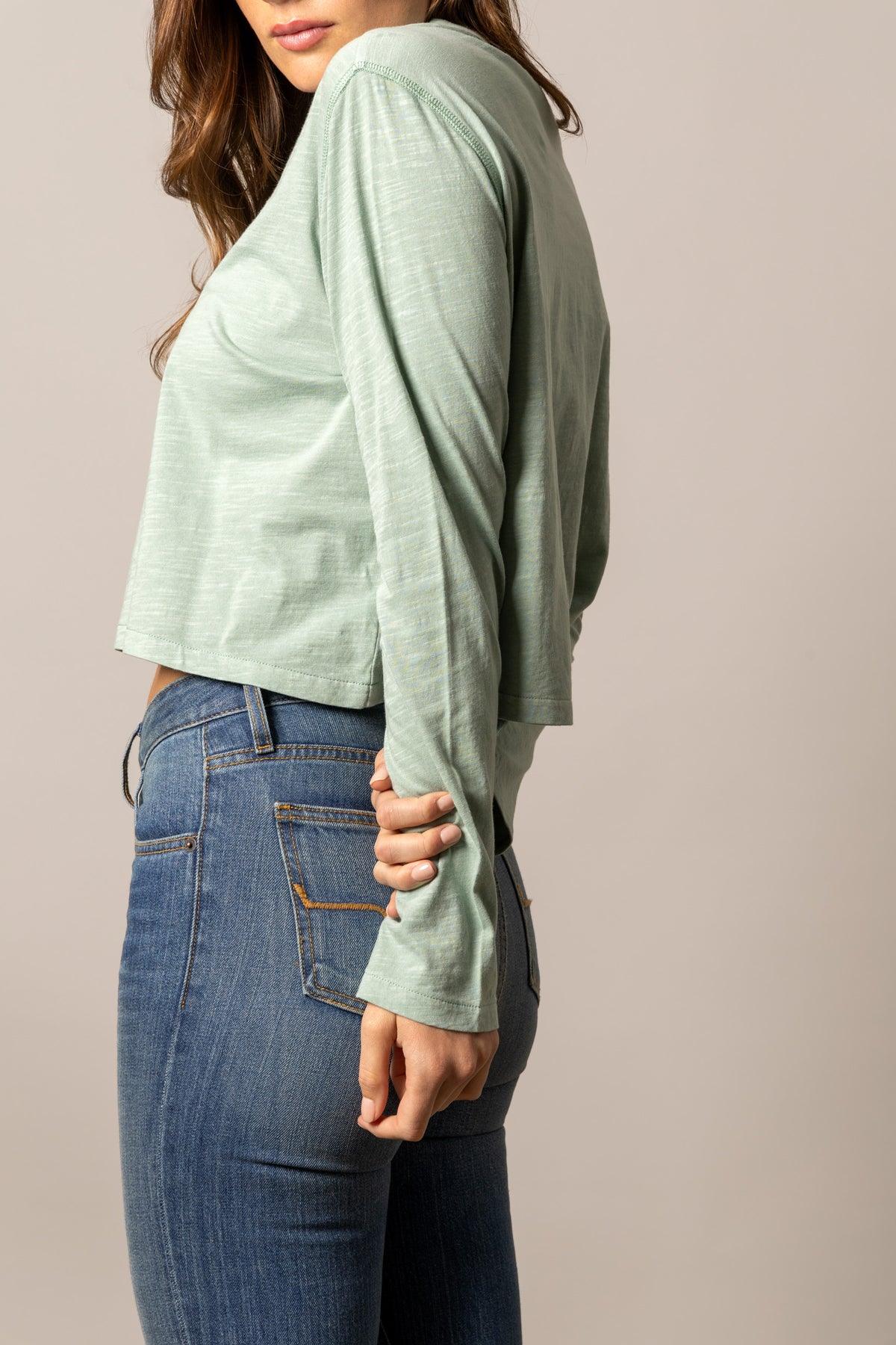 Kimes Ranch Tackroom long sleeve shirt in Grey Sage, side view, with a cropped hem and ribbed cuffs