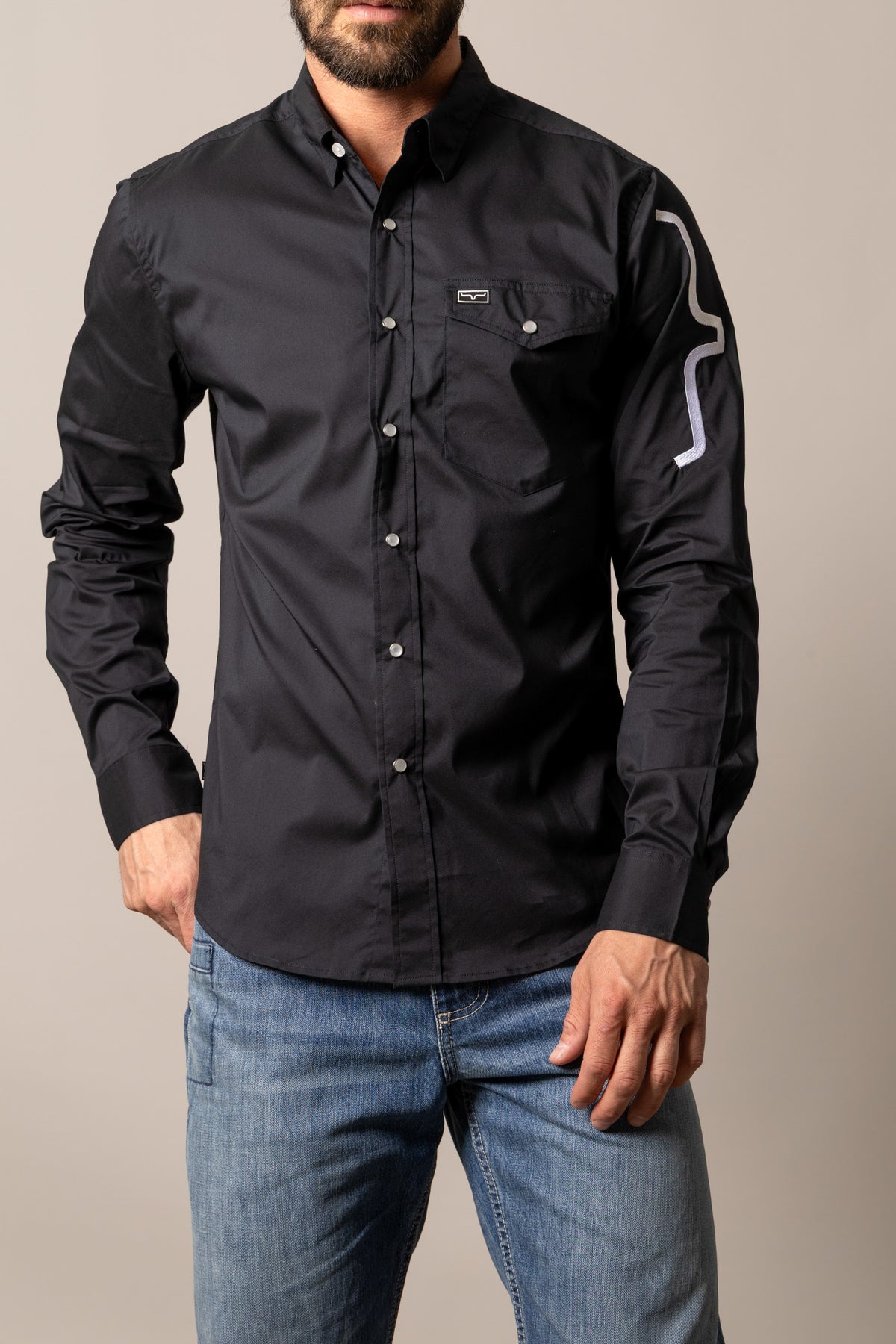 Kimes Ranch Talbott Black dress shirt with a chest pocket and a white logo on the sleeve