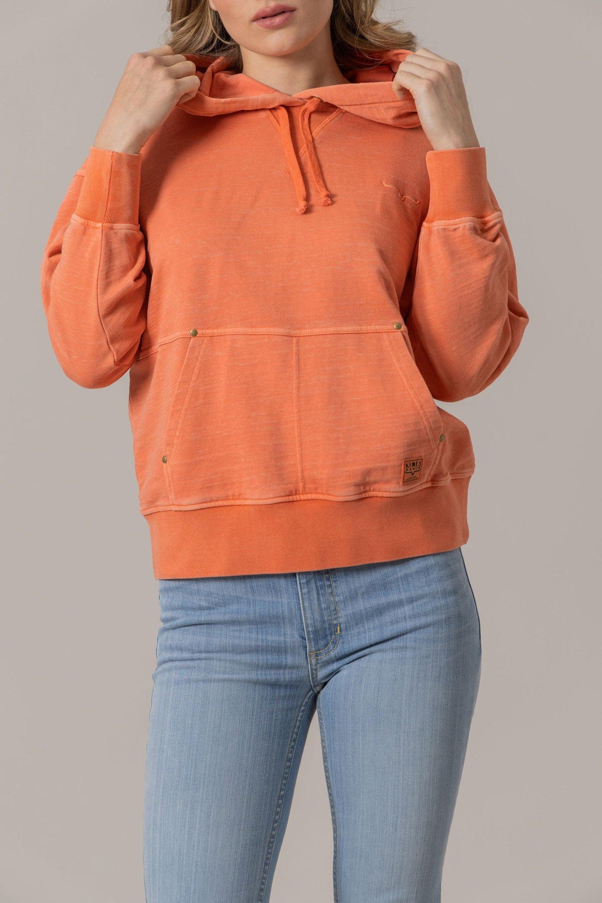 Kimes Ranch Tess Western Hoodie in Orange with a kangaroo pocket and embroidered logo