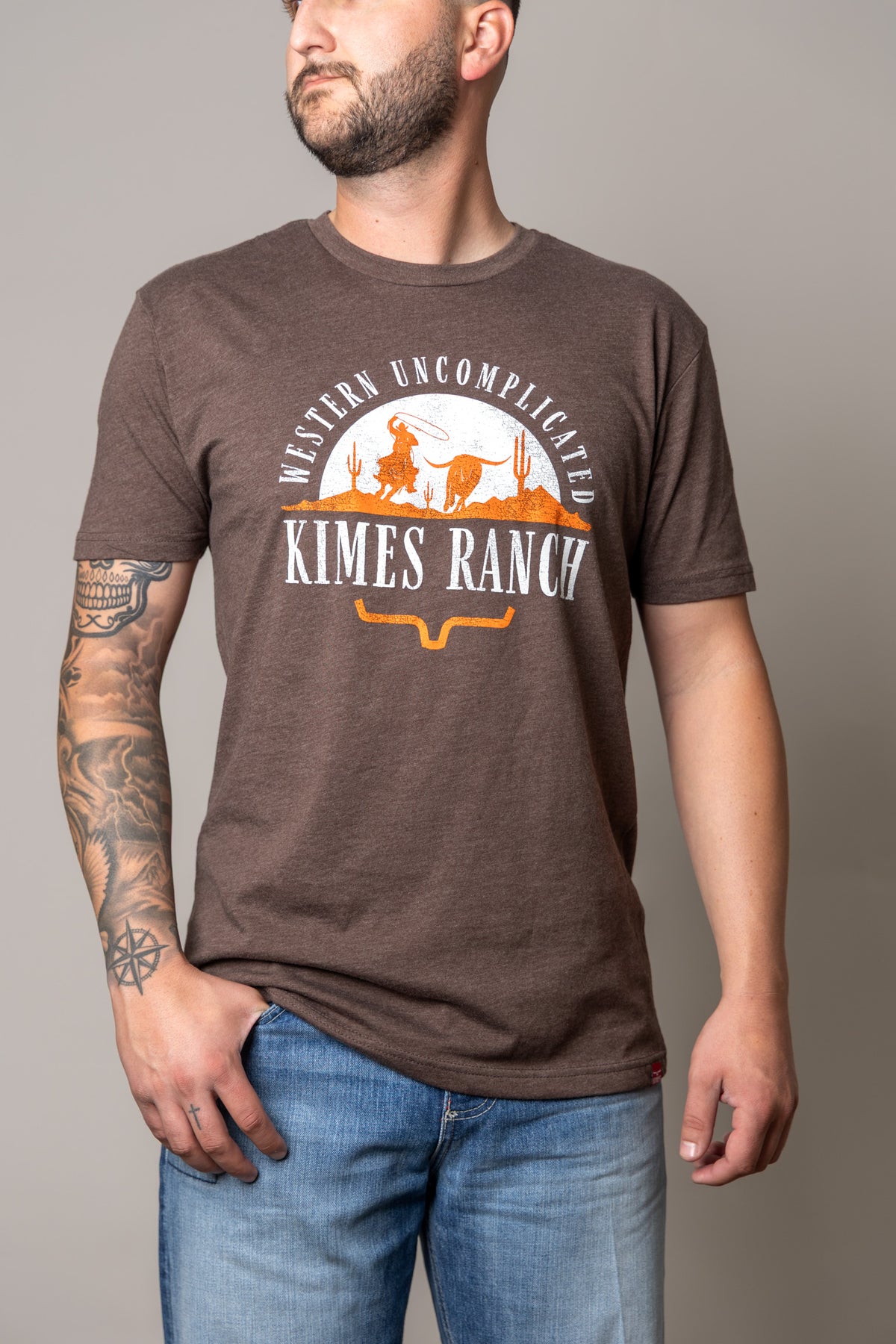 Kimes Ranch The Chase short sleeve shirt in Espresso with a Western Uncomplicated graphic and Kimes Ranch logo