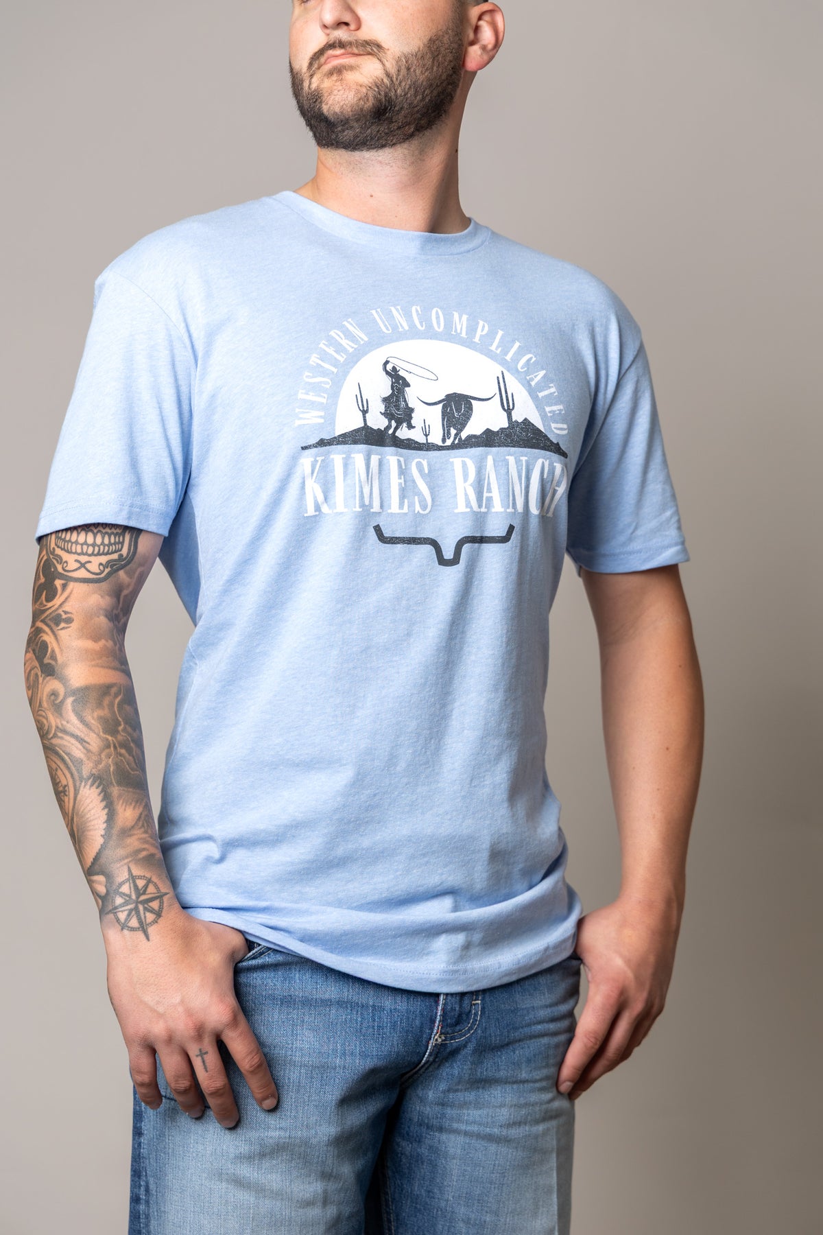 Kimes Ranch The Chase shirt in Heather Columbia Blue with a Western Uncomplicated graphic and logo