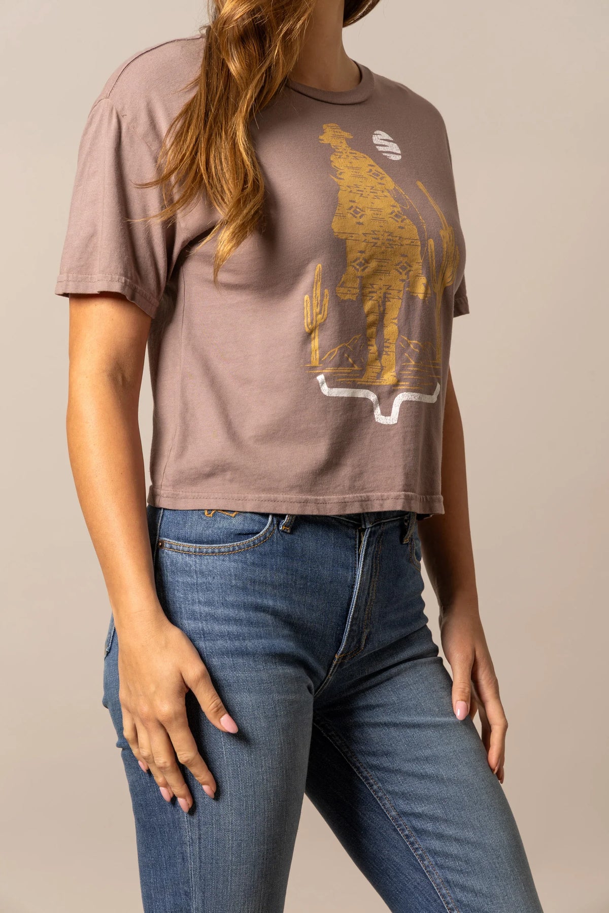 Kimes Ranch The Road shirt in Mocha with a graphic of a cowboy and cactus with a the Kimes Ranch logo