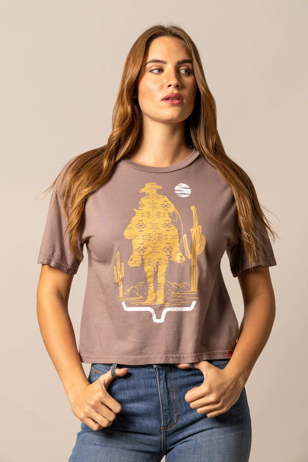 Kimes Ranch The Road Mocha short sleeve shirt with a graphic of a cowboy and cactus
