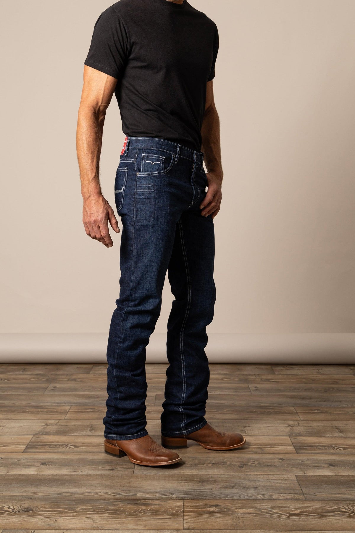 Kimes Ranch Thomas Straight Fit Bootcut jeans in dark indigo with contrast stitching and a red brand tab