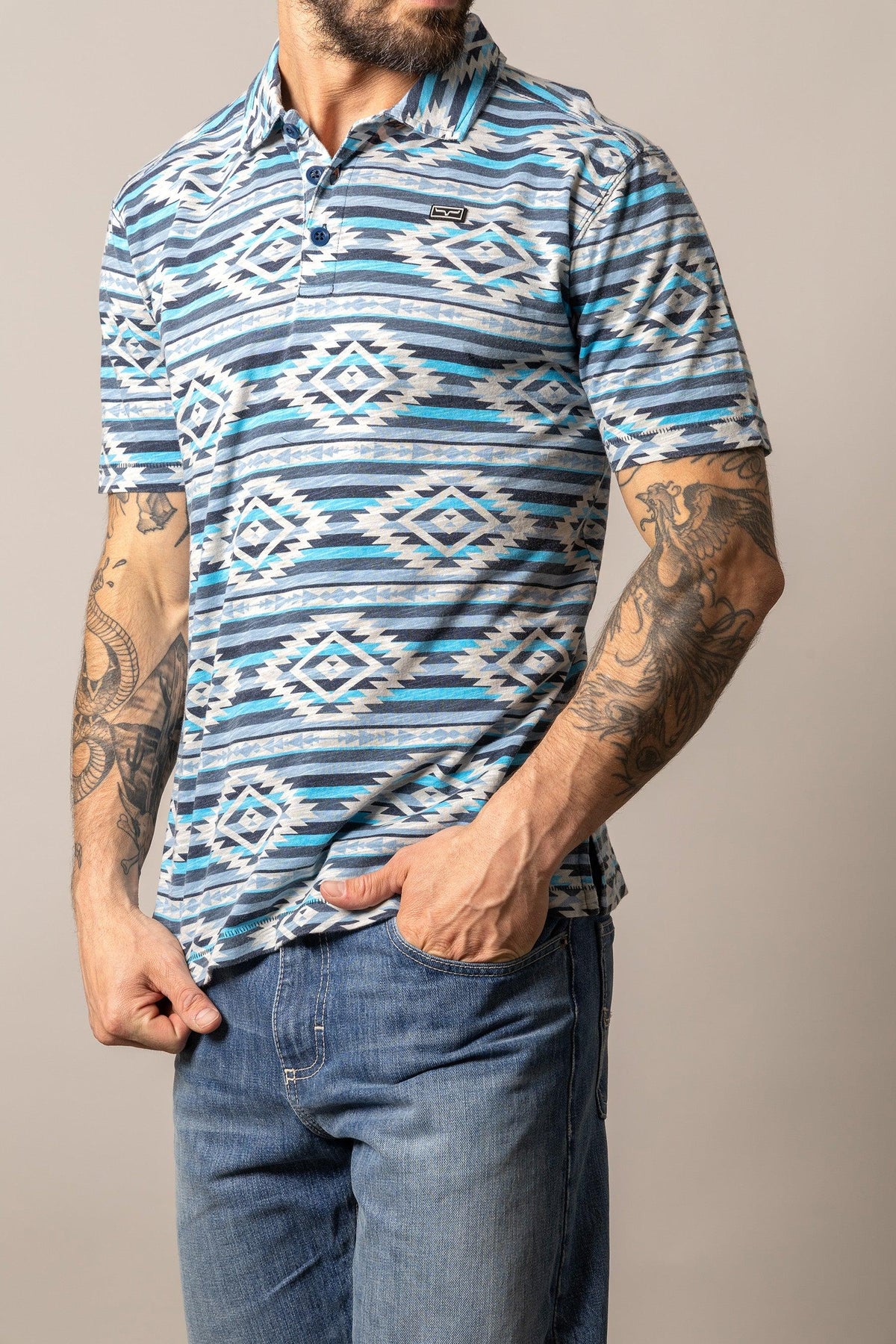 Kimes Ranch Tulum Polo in Navy with a geometric diamond pattern and short sleeves