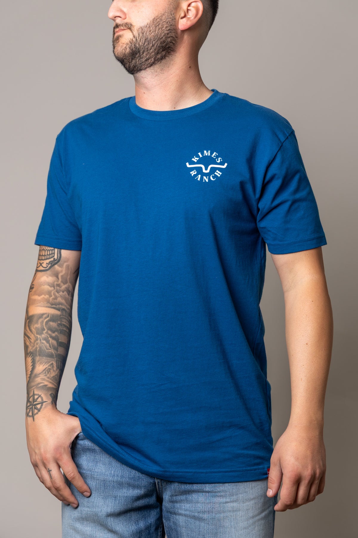 Kimes Ranch Uncomplicated shirt in Cool Blue with a white Kimes Ranch logo on the chest