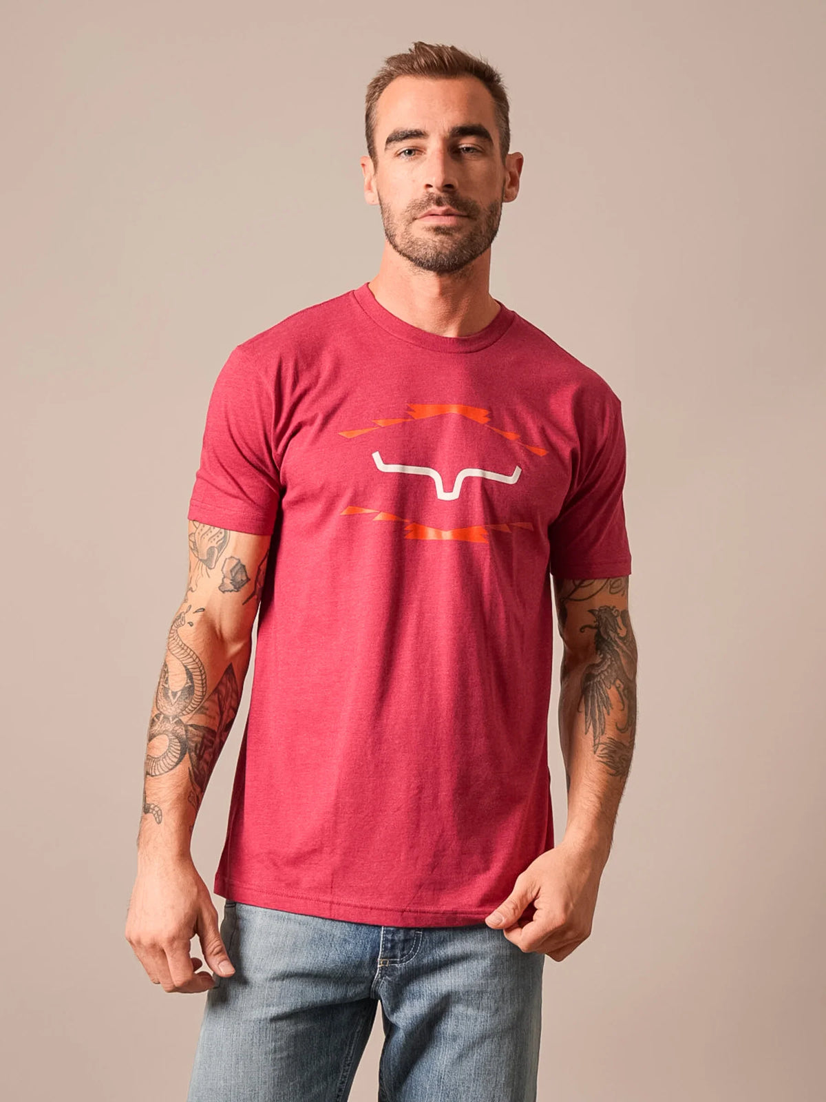 Kimes Ranch Vintage Badge shirt in Cardinal with a stylized steer logo and orange graphic accents